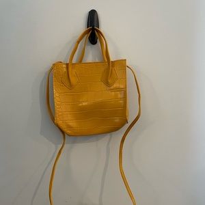 Small yellow bag with strap